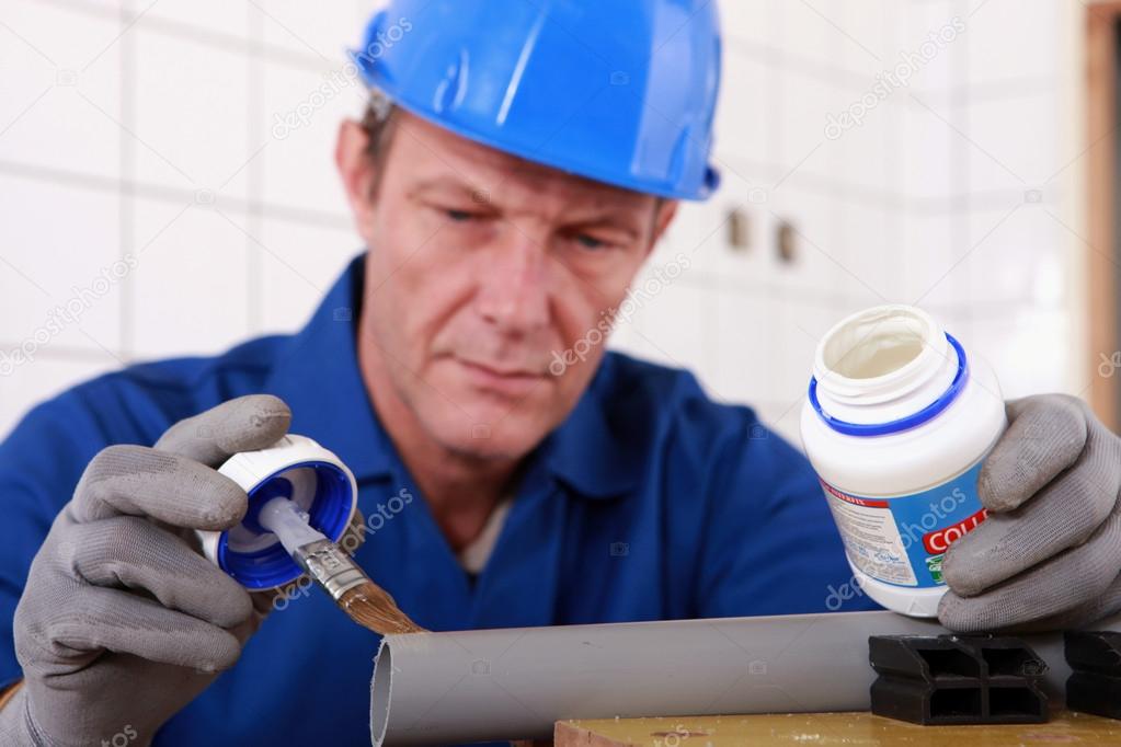 Plumber joining plastic pipe — Stock Photo © photography33 14551953