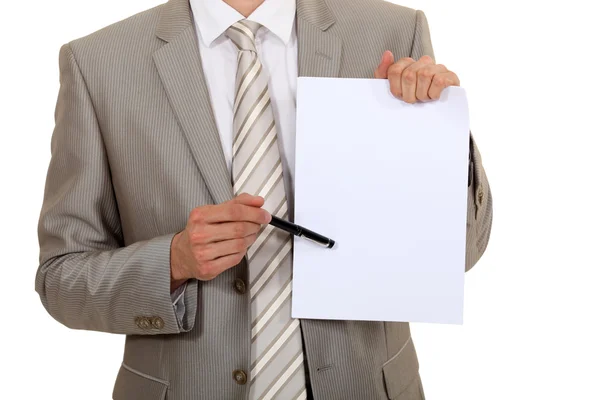 Businessman pointing to a blank sheet of paper — Stock Photo, Image