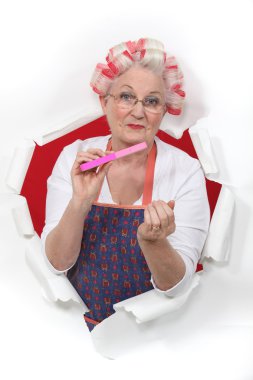 Old fashioned woman wearing hair rollers clipart