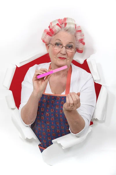 Old fashioned woman wearing hair rollers — Stock Photo, Image