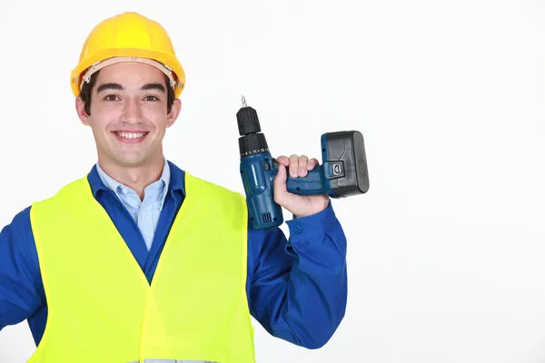 Man aan het werk met draadloze boren — Stockfoto