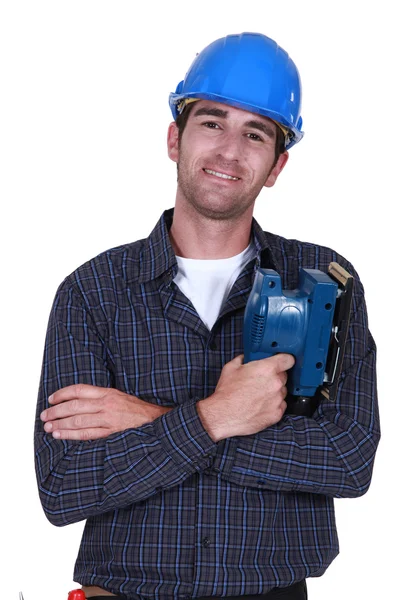 Hombre sosteniendo lijadora eléctrica —  Fotos de Stock
