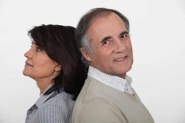 Husband and wife standing back to back — Stock Photo, Image