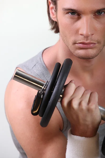 Blonde man doing fitness with dumbbell — Stock Photo, Image