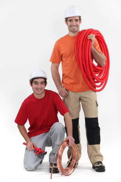 Duo of cheerful plumbers — Stock Photo, Image