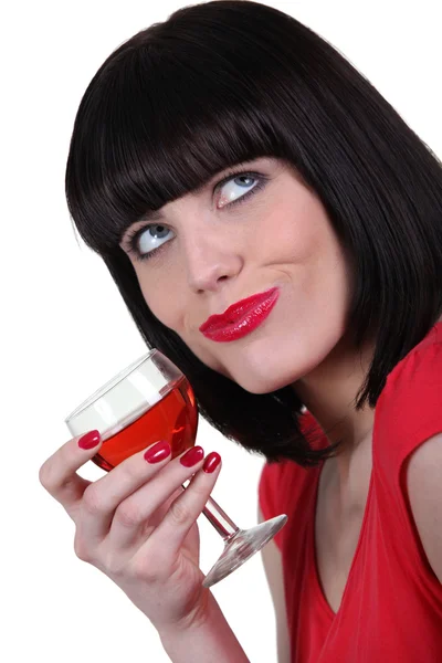 Brunette drinking glass of wine — Stok fotoğraf