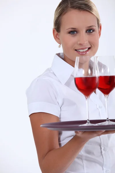 Waitress with tray and glasses Stock Image