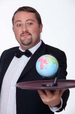 Man bringing the globe on a plate clipart
