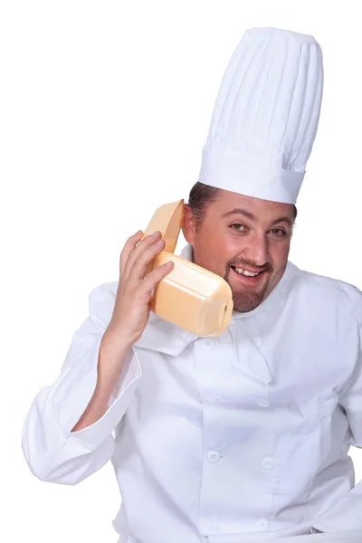 Cozinhe usando uma caixa de hambúrguer como um telefone — Fotografia de Stock