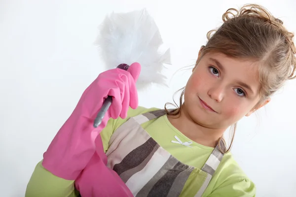 Little girl with duster — Stock Photo, Image