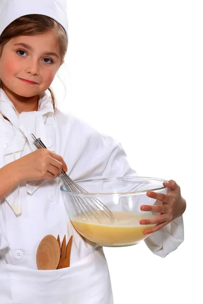 Porträt eines kleinen Mädchens in Bäckerbekleidung — Stockfoto