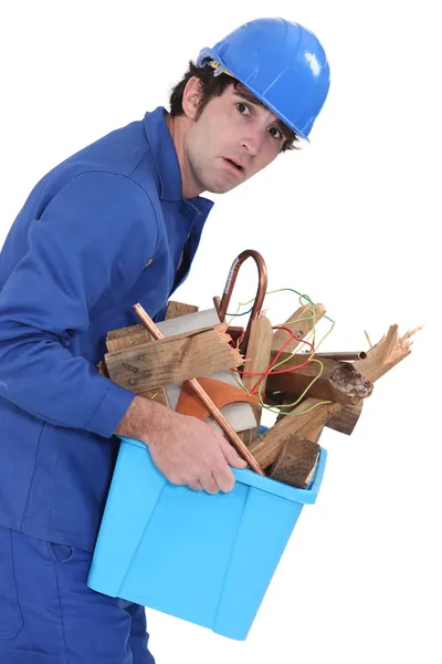 A weird man carrying scraps. — Stock Photo, Image