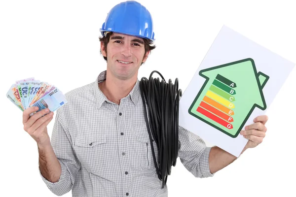 Heating engineer holding bank notes rejoycing over purchase power — Stock Photo, Image