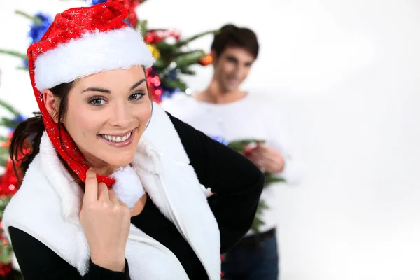 Couple with a Christmas tree Stock Photo