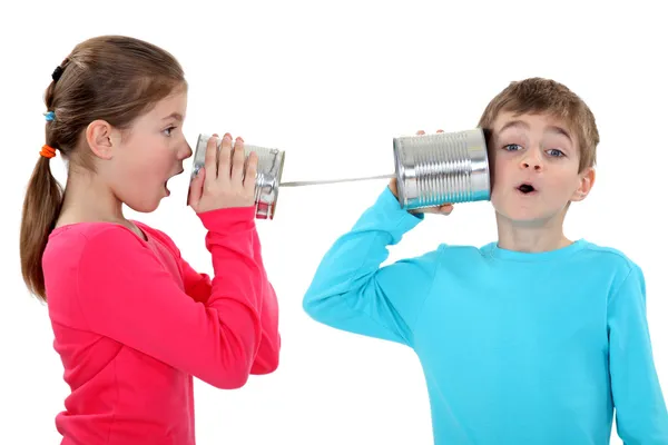 Kids playing with tins — Stock Photo, Image