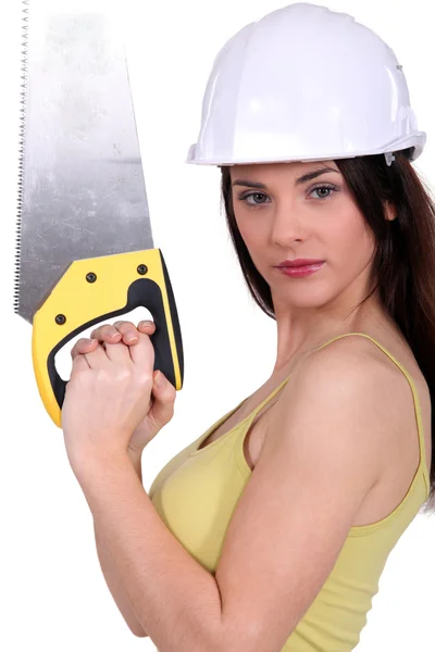 Woman holding up a crosscut saw — Stock Photo, Image