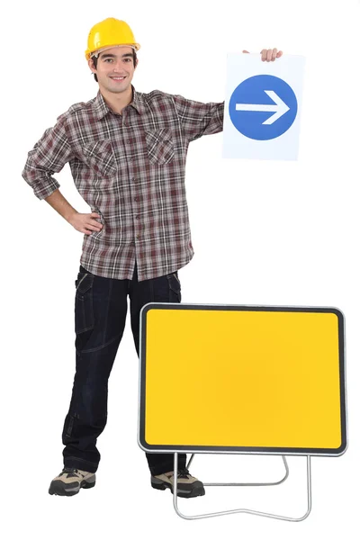 Man holding traffic sign — Stock Photo, Image