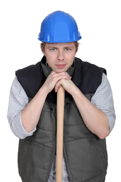 Man resting head on sledge-hammer — Stock Photo, Image