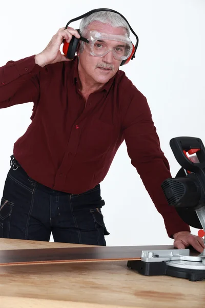 Man using a mitre saw — Stock Photo, Image