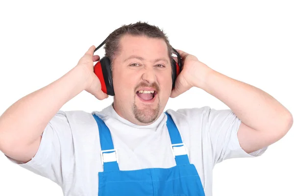 Worker wearing earmuffs — Stock Photo, Image