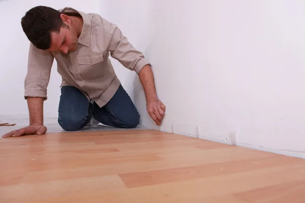 DIY fan laying laminate flooring — Stok fotoğraf