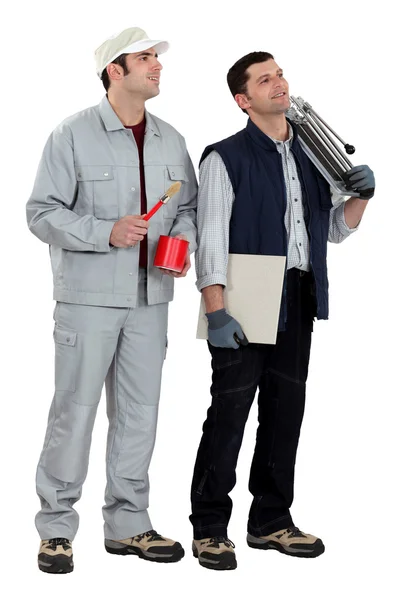 A painter and a tiler. — Stock Photo, Image