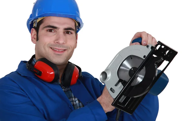 Man holding circular saw — Stok fotoğraf