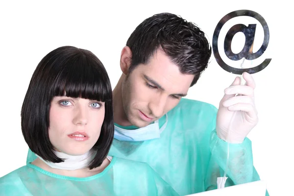 Doctors with an at symbol — Stock Photo, Image