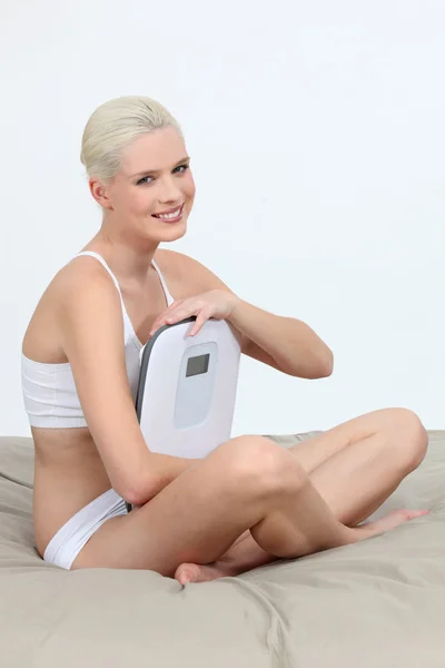 Woman in her underwear with a set of scales — Stock Photo, Image