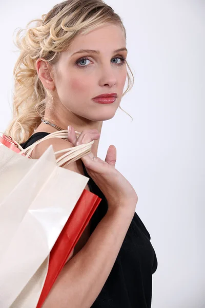 Glamorous woman with store bags Stock Picture