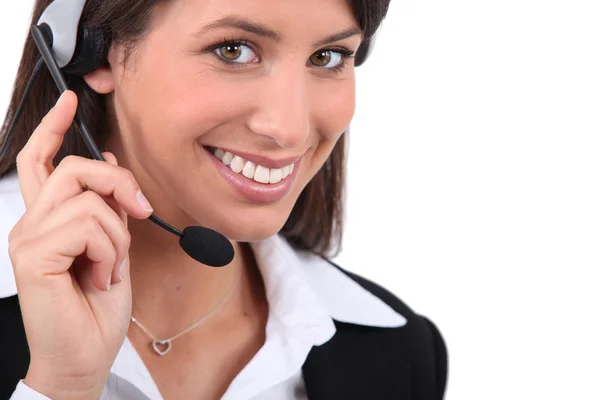 Smiling woman with headset Royalty Free Stock Photos