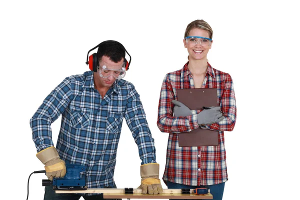 Woman inspecting builders work — Stock Image Woman inspecting builders work Stock Picture