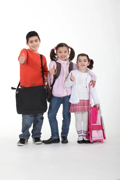 Three schoolkids with bags — Stock Photo, Image