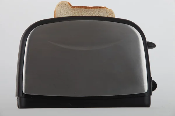 Slice of white bread in a toaster — Stock Photo, Image