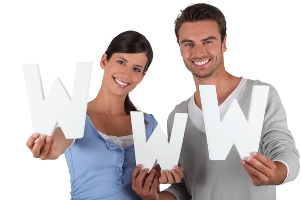 Young couple holding WWW — Stock Photo, Image