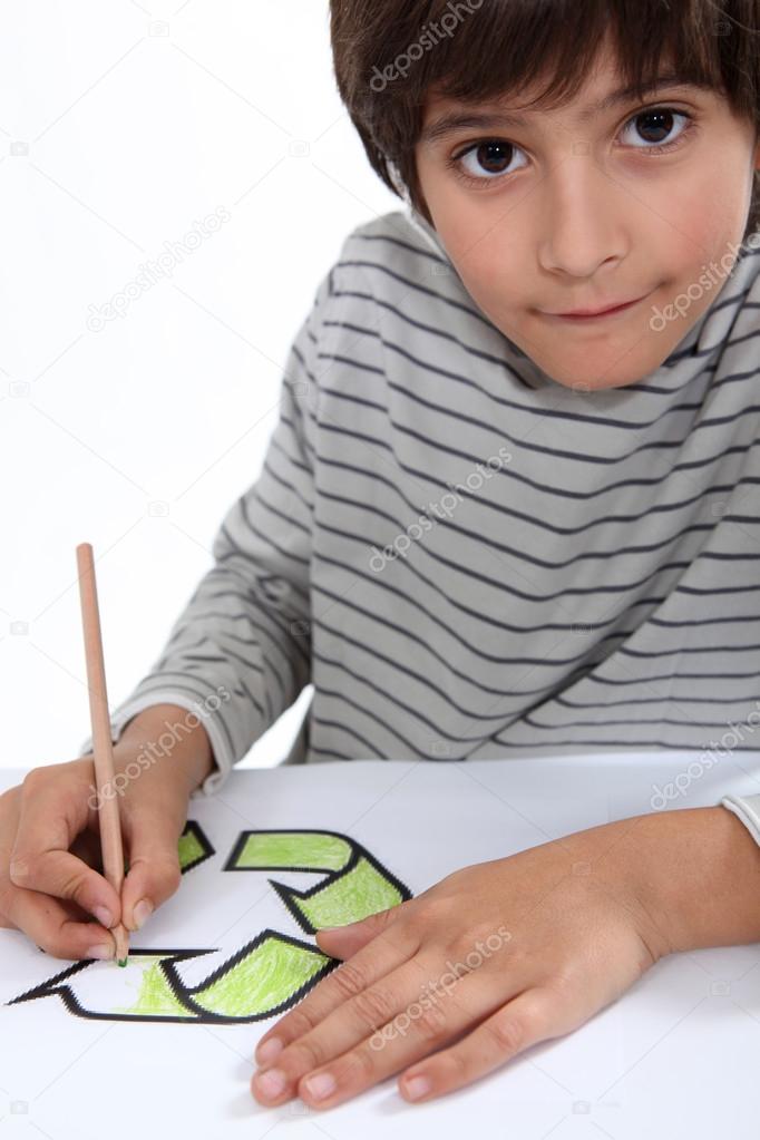 Little boy drawing the recycle logo