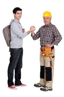 Carpenter welcoming his trainee clipart