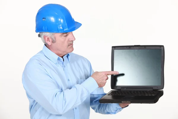 Architect pointing at laptop — Stock Photo, Image