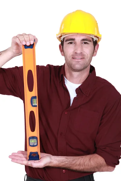 Craftsman with spirit-level — Stock Photo, Image