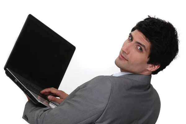 Businessman holding laptop — Stock Photo, Image