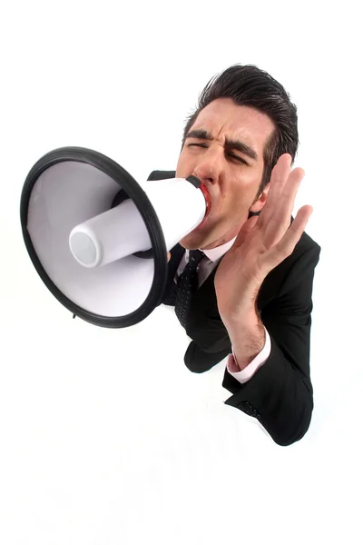 Businessman yelling into a megaphone — Stock Photo, Image