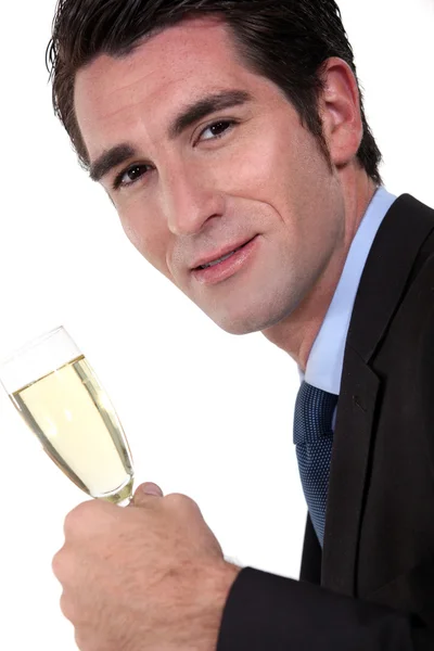 Zakenman bedrijf champagne fluit — Stockfoto