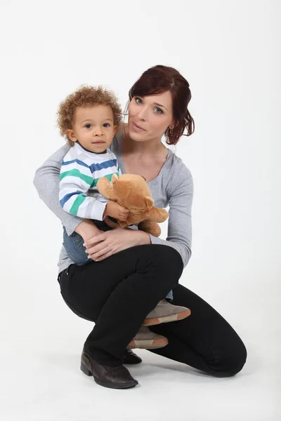 Mother and son with teddy bear — Stock Photo, Image