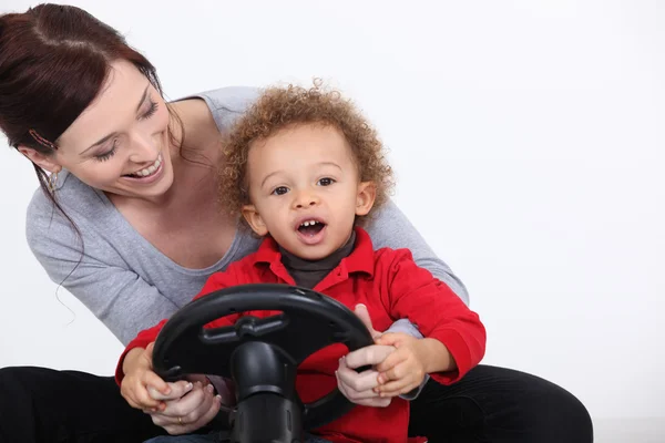 Little boy with steering wheel — Stock Photo, Image