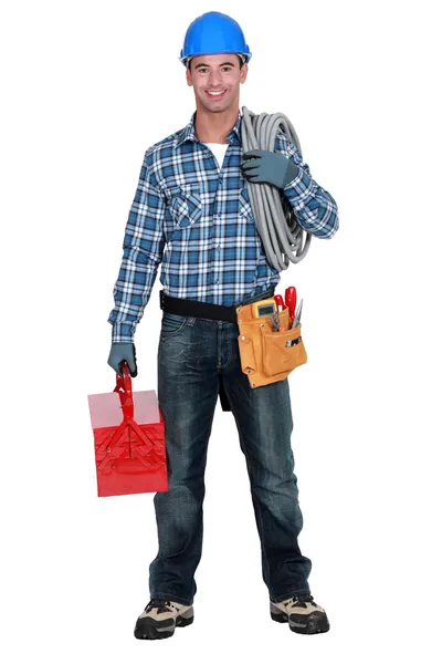 Portrait of a tradesman with his tools — Stock Photo, Image