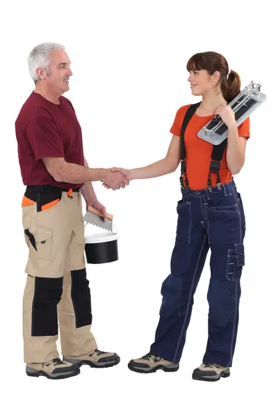 Craftsman and craftswoman shaking hands — Stock Photo, Image