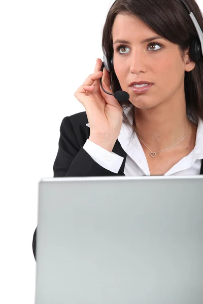 Businesswoman wearing headset Stock Picture