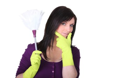 A maid with a feather duster clipart