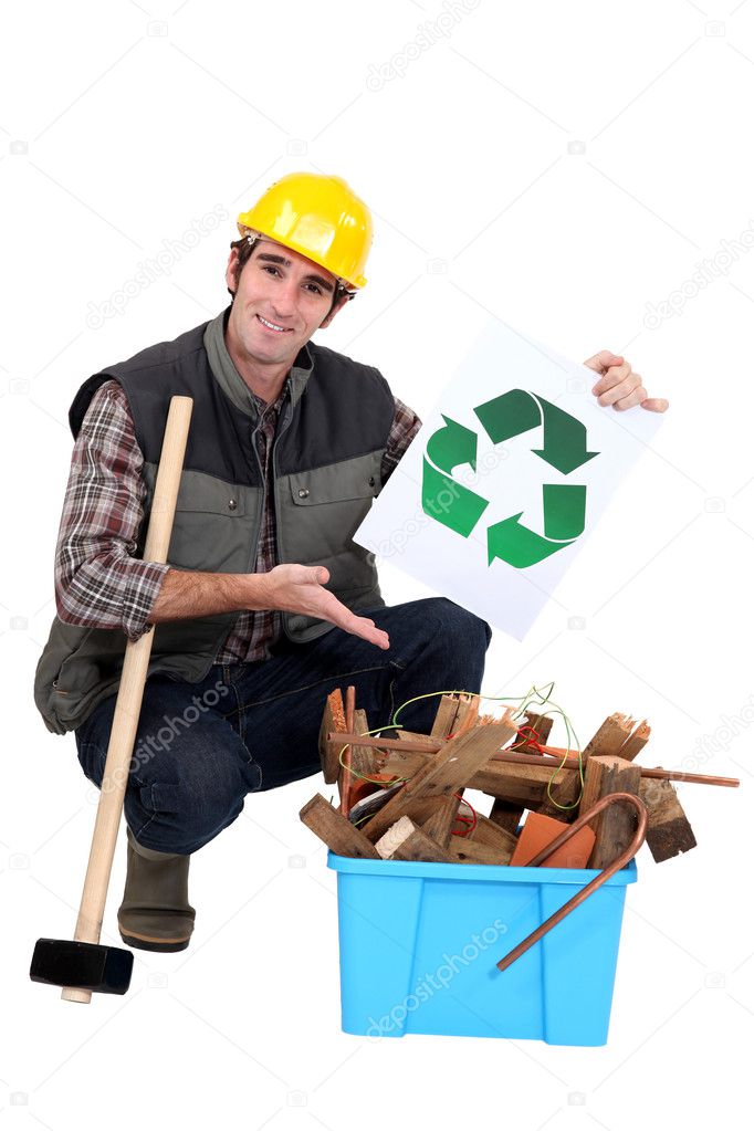 Portrait of carpenter showing recycling logo