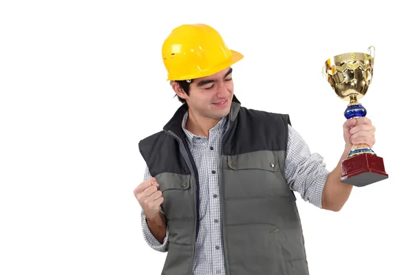 Excited builder holding trophy — Stock Photo, Image